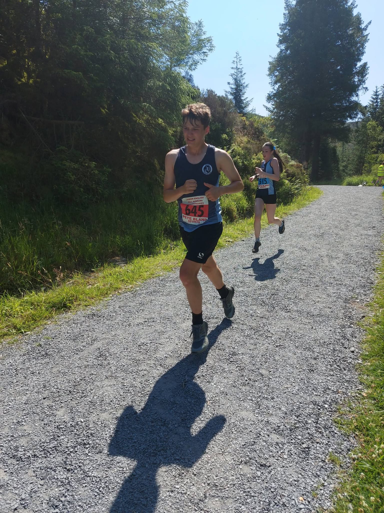 Two Buxton AC juniors competing in a fell race